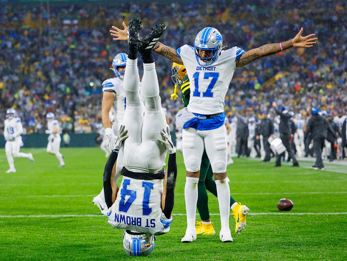 Detroit Lions watch party NFL Divisional Round playoff game-AmonRa St Brown head-stand